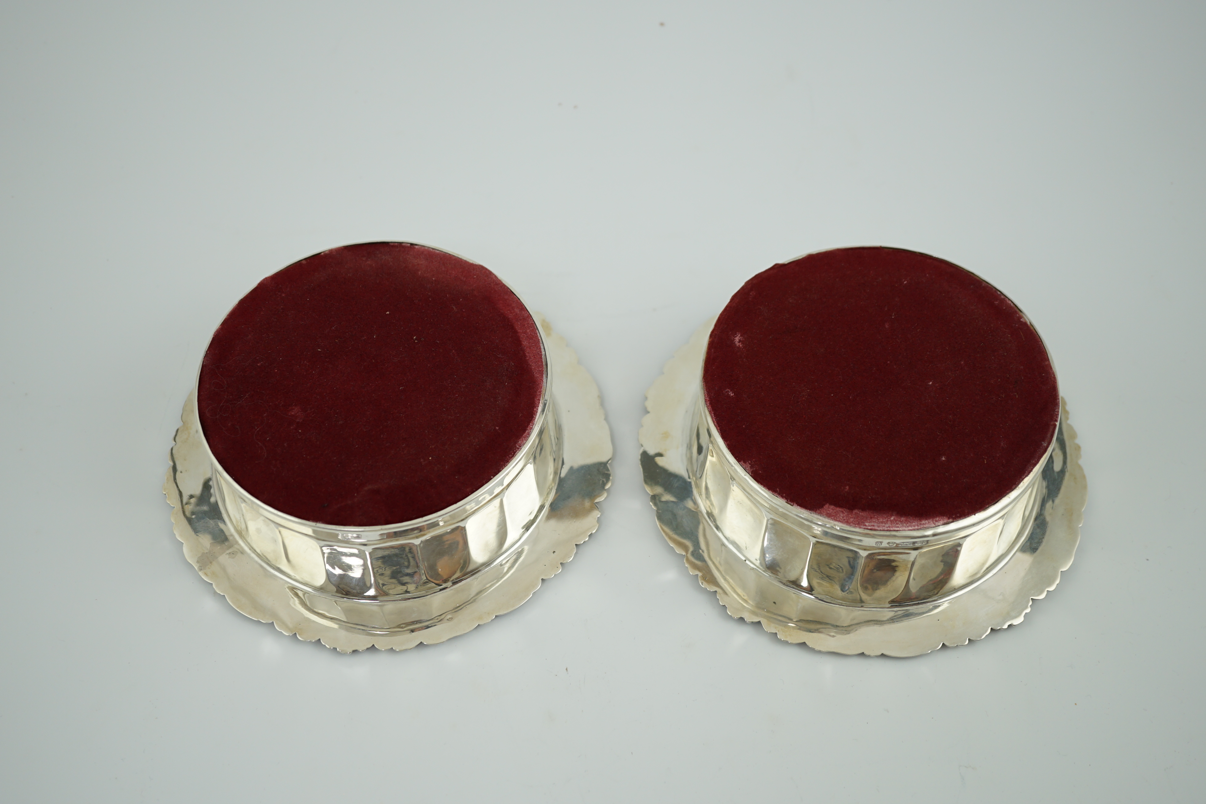 A pair of George III silver mounted wine coasters, by John & Thomas Settle Gunn & Co